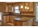 Bright kitchen with wooden cabinetry, granite countertops, and stainless steel sink at 3572 Dexter Way, Marietta, GA 30062