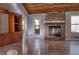Living room showcases a stone fireplace, hardwood floors, built-in shelving and natural light at 3572 Dexter Way, Marietta, GA 30062