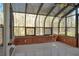 Bright sunroom with a wall of windows offers peaceful views of the surrounding landscape at 3572 Dexter Way, Marietta, GA 30062