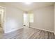 Bright bedroom featuring updated gray floors and large window at 3697 Wisteria Sw Ln, Atlanta, GA 30331