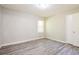 Neutral bedroom showcasing gray flooring and a window for natural light at 3697 Wisteria Sw Ln, Atlanta, GA 30331