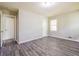 Bedroom with gray flooring, two closet doors, and a window at 3697 Wisteria Sw Ln, Atlanta, GA 30331