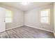 Bedroom with updated gray flooring, natural light, and neutral paint at 3697 Wisteria Sw Ln, Atlanta, GA 30331