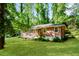 Charming brick home featuring a well-manicured lawn and a welcoming wood porch at 3697 Wisteria Sw Ln, Atlanta, GA 30331