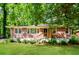 Charming brick home featuring a well-manicured lawn and a welcoming wood porch at 3697 Wisteria Sw Ln, Atlanta, GA 30331
