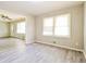 Cozy living room with luxury vinyl flooring, ample natural light, and neutral walls at 3697 Wisteria Sw Ln, Atlanta, GA 30331
