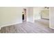 Open-concept living space with luxury vinyl flooring and neutral paint throughout at 3697 Wisteria Sw Ln, Atlanta, GA 30331