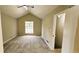 Bright bedroom with vaulted ceiling and a large window at 381 Fleming Ct, Jonesboro, GA 30238