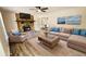 Staged living room with a stone fireplace, hardwood floors, and stylish furniture at 381 Fleming Ct, Jonesboro, GA 30238