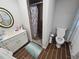 Bathroom with a modern vanity, updated shower, and tiled floors at 5655 Lake Forrest Dr, Atlanta, GA 30342