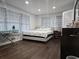 Comfortable bedroom with a full-size bed, wood floors, and a closet at 5655 Lake Forrest Dr, Atlanta, GA 30342