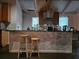 Kitchen with bar seating, stainless steel appliances, and modern countertops at 5655 Lake Forrest Dr, Atlanta, GA 30342