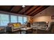 Bright living room featuring plush sofas, a marble coffee table, and large windows at 5655 Lake Forrest Dr, Atlanta, GA 30342