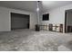 Unfinished living room showing open doorways, exposed drywall, and rough concrete flooring at 5655 Lake Forrest Dr, Atlanta, GA 30342