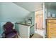 Upper level landing featuring a chair, dresser and view into a bathroom at 725 Brown Pl, Decatur, GA 30030
