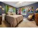 Charming bedroom featuring a comfortable bed, dark walls, and natural light at 725 Brown Pl, Decatur, GA 30030