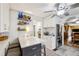 Eat-in kitchen with white cabinets, stainless steel appliances, and stylish barstool seating at 725 Brown Pl, Decatur, GA 30030
