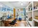 Inviting home office with built-in shelving, a large desk, and natural light from the window at 725 Brown Pl, Decatur, GA 30030