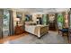 Bedroom featuring hardwood floors, multiple windows, and an elegant gold-colored sleigh bed at 1676 Grove Park Way, Decatur, GA 30033