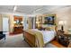 Large bedroom featuring coffered ceilings, hardwood floors, and natural light from several windows at 1676 Grove Park Way, Decatur, GA 30033