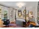 Cozy bedroom with a four-poster bed, hardwood floors, and bright natural light at 1676 Grove Park Way, Decatur, GA 30033