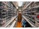 Organized walk-in closet with shelves full of shoes and clothing racks on both sides at 1676 Grove Park Way, Decatur, GA 30033