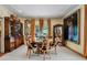 Elegant dining room with a round table, exquisite decor, and ample natural light for gatherings at 1676 Grove Park Way, Decatur, GA 30033