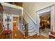 Elegant staircase and hardwood floors flow through the foyer of this beautifully appointed home at 1676 Grove Park Way, Decatur, GA 30033