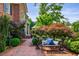 Paver walkway leads to the entrance of this beautiful home and sitting area amidst lush landscaping at 1676 Grove Park Way, Decatur, GA 30033