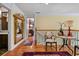 Upstairs hallway featuring hardwood floors and a view into a bedroom with ensuite bathroom at 1676 Grove Park Way, Decatur, GA 30033