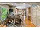 Well-lit kitchen and dining area with large windows, stainless appliances, and beautiful flooring at 1676 Grove Park Way, Decatur, GA 30033