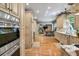 The modern kitchen features stainless appliances, custom cabinetry, and seamless access to living areas at 1676 Grove Park Way, Decatur, GA 30033