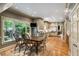 Bright kitchen and dining area with large window views, stainless appliances, and wood floors at 1676 Grove Park Way, Decatur, GA 30033