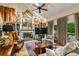 Elegant living room featuring a fireplace, high ceilings with skylight and a ceiling fan at 1676 Grove Park Way, Decatur, GA 30033