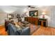 A cozy living room features a large TV, comfortable seating, and sports memorabilia at 1676 Grove Park Way, Decatur, GA 30033