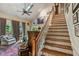 View of hardwood staircase with white railings, hardwood floors, and vaulted ceilings at 1676 Grove Park Way, Decatur, GA 30033
