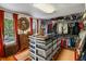 Large walk-in closet with organized shelving, clothing racks, and a central island with storage at 1676 Grove Park Way, Decatur, GA 30033
