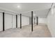 Unfinished basement with painted walls and black support beams is ready to be customized at 1892 Buford Dam Rd, Buford, GA 30518