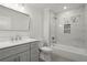 Modern bathroom featuring a shower and tub combination, white vanity and tile at 1892 Buford Dam Rd, Buford, GA 30518