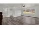 Spacious bedroom with multiple windows, hardwood floors, and a view of the backyard at 1892 Buford Dam Rd, Buford, GA 30518