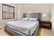Cozy bedroom with a large window, comfortable bed, and stylish bedside table with lamp at 195 14Th St # 1501, Atlanta, GA 30308