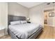 Cozy bedroom featuring a comfy bed, an ensuite bathroom, and sleek bedside table with lamp at 195 14Th St # 1501, Atlanta, GA 30308