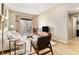 Bright living room featuring modern furniture, wood floors, and a large window showcasing the city view at 195 14Th St # 1501, Atlanta, GA 30308
