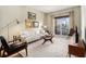 Bright living room featuring modern furniture, wood floors, and a large window showcasing the city view at 195 14Th St # 1501, Atlanta, GA 30308