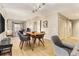 Open-concept living room with wood floors, modern furnishings, and a dining area, ideal for entertaining or relaxing at 195 14Th St # 1501, Atlanta, GA 30308