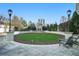 Relaxing courtyard with manicured lawn, lounge chairs, and decorative gazebo at 195 14Th St # 1501, Atlanta, GA 30309