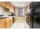 Functional kitchen space with tiled floors, and black appliances at 195 14Th St # 1501, Atlanta, GA 30309