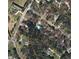 Aerial view of property showing location on a treed lot near Chambers Rd and Willow Way at 195 Willow Way, Stockbridge, GA 30281