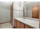 Bathroom features a single vanity, light wood cabinets, and a shower with white tiled walls at 195 Willow Way, Stockbridge, GA 30281