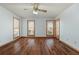 Inviting bedroom with beautiful wood floors, ceiling fan and natural light from the double windows at 195 Willow Way, Stockbridge, GA 30281